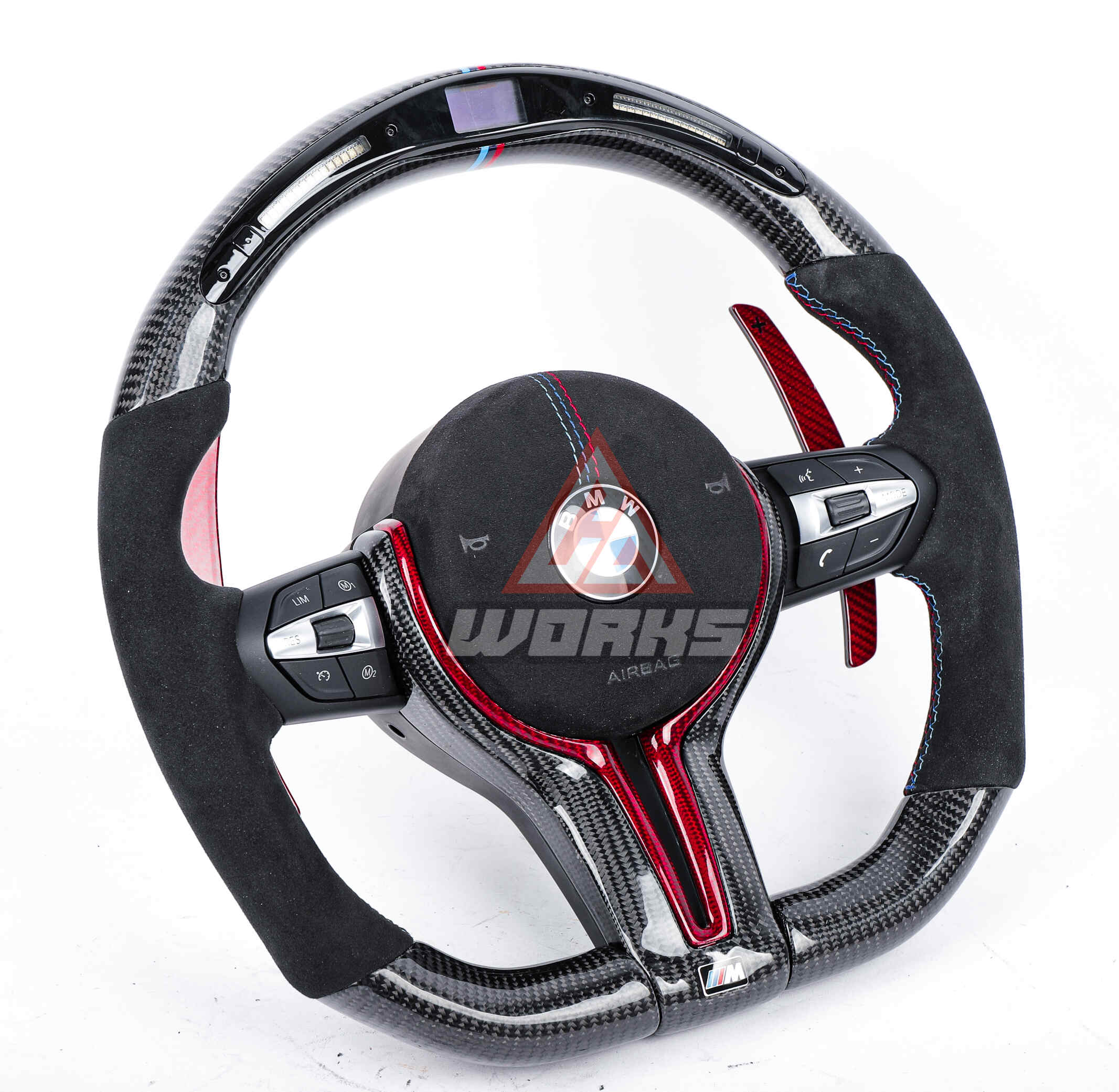 A customized, 2014+ generation, BMW F Chassis M steering wheel, in gloss black carbon fiber, black alcatantara side grips and airbag with m color stitching, gloss red carbon fiber extended paddle shifters and led shift lights.